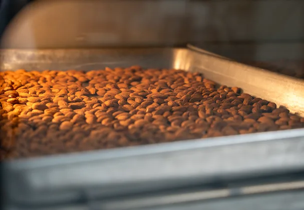 Slow-roasting nuts by watching colour and aroma, not timers